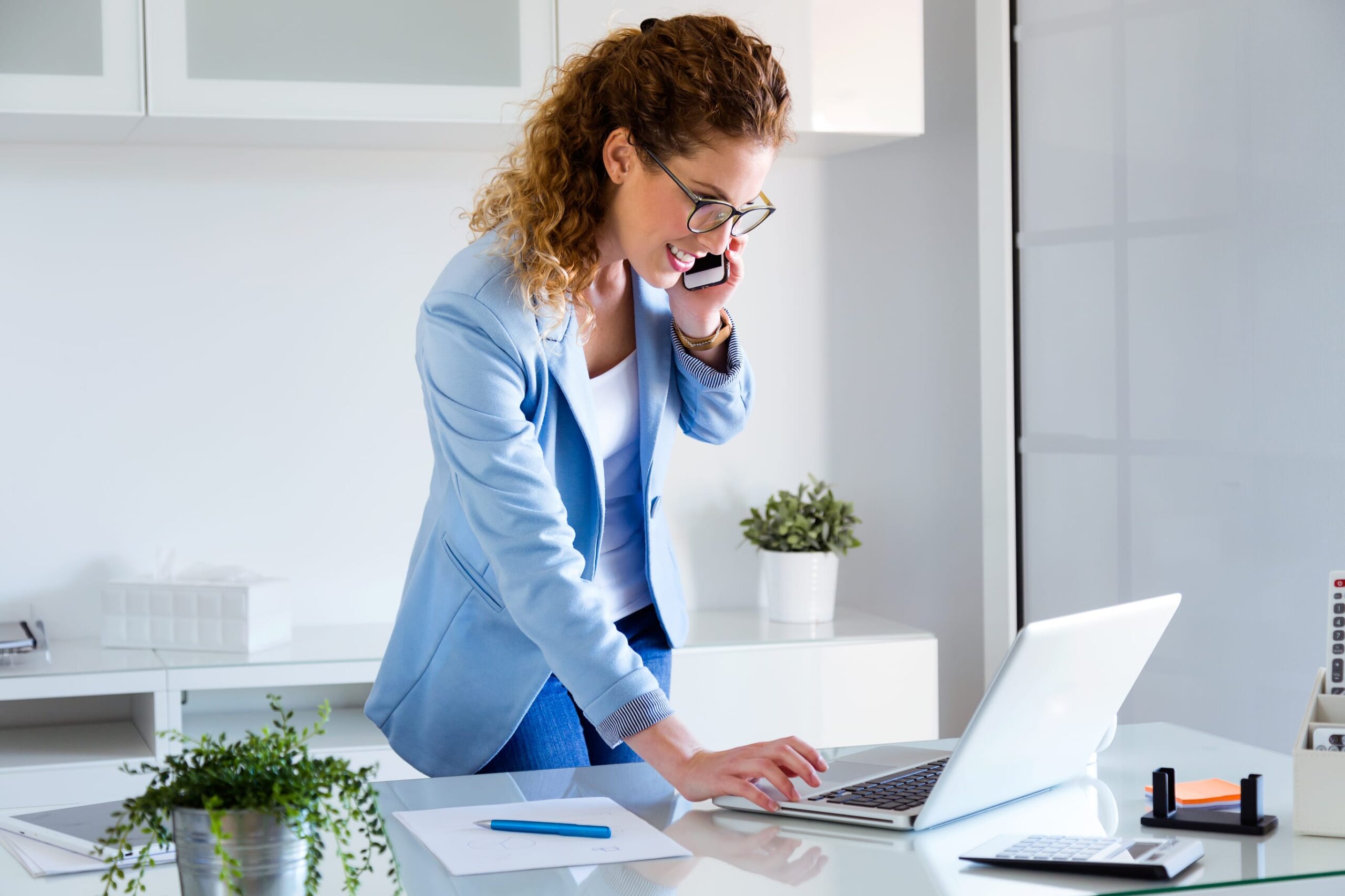 young woman on computer in office